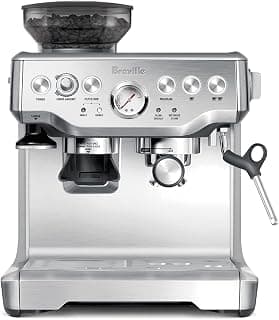 Craft café-quality espresso shots, lattes and cappuccinos at home with this manual coffee maker with built-in grinder